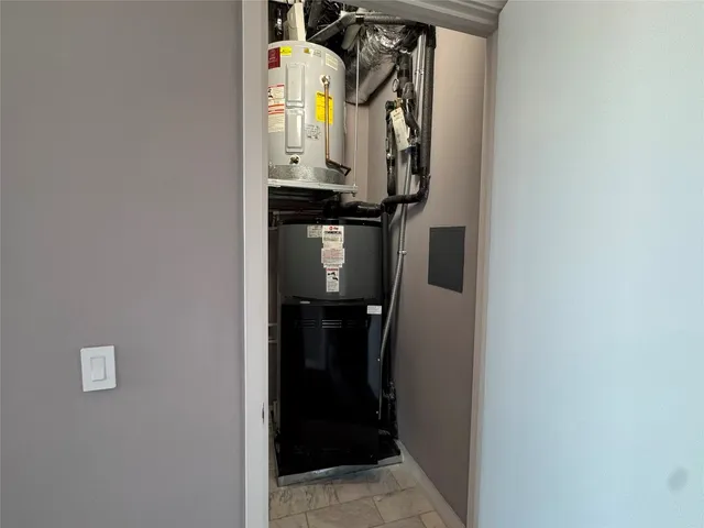 a view of an empty room with glass door