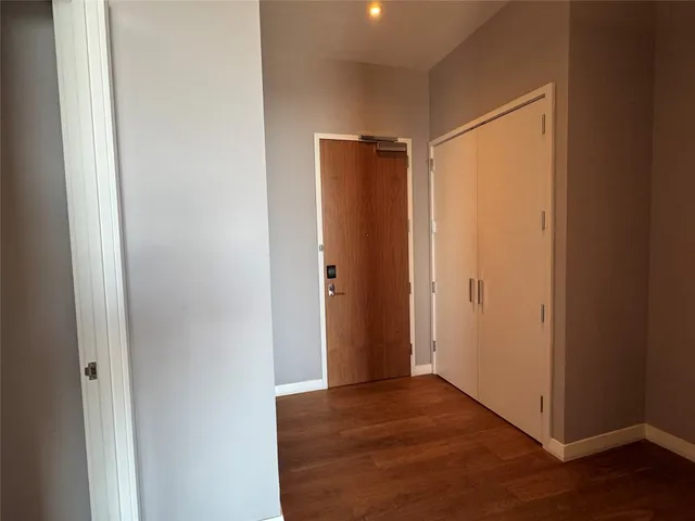a bathroom with a granite countertop sink a toilet and bathtub