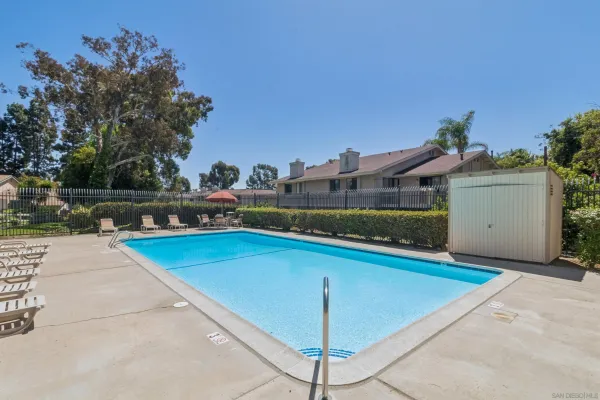 a view of swimming pool with seating space