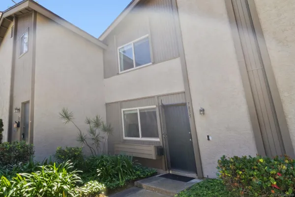 a house that has a potted plant on it