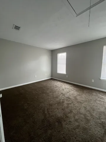 an empty room with a empty space and window