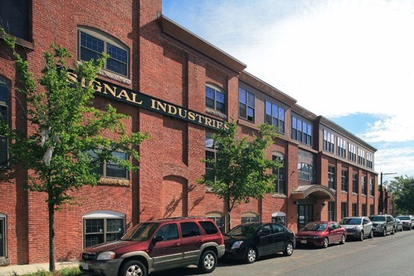 154 West 2nd Street, Unit 301 Boston, MA 02127 - Photo 13 of 13 a couple of cars parked in front of brick building