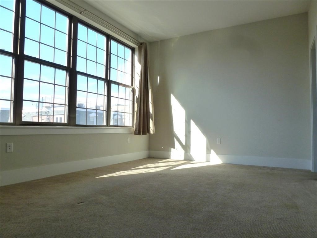 154 West 2nd Street, Unit 301 Boston, MA 02127 - Photo 9 of 13 an empty room with a window