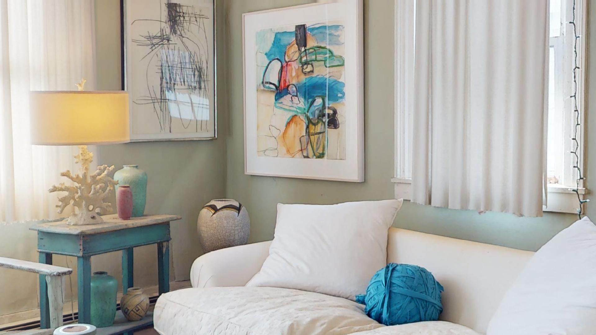 580 Commercial Street Provincetown, MA 02657 - Photo 15 of 58 a living room with furniture and a window