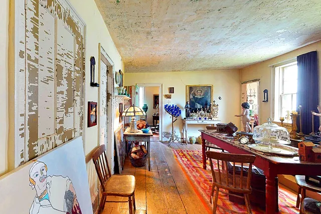 view of a dining room with a table and chairs