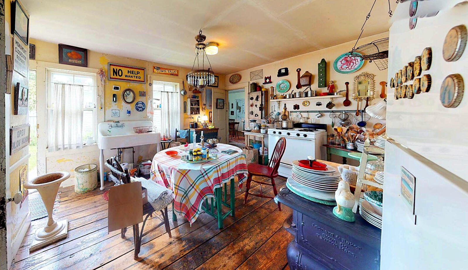 580 Commercial Street Provincetown, MA 02657 - Photo 39 of 58 a view of a dining room with furniture and wooden floor