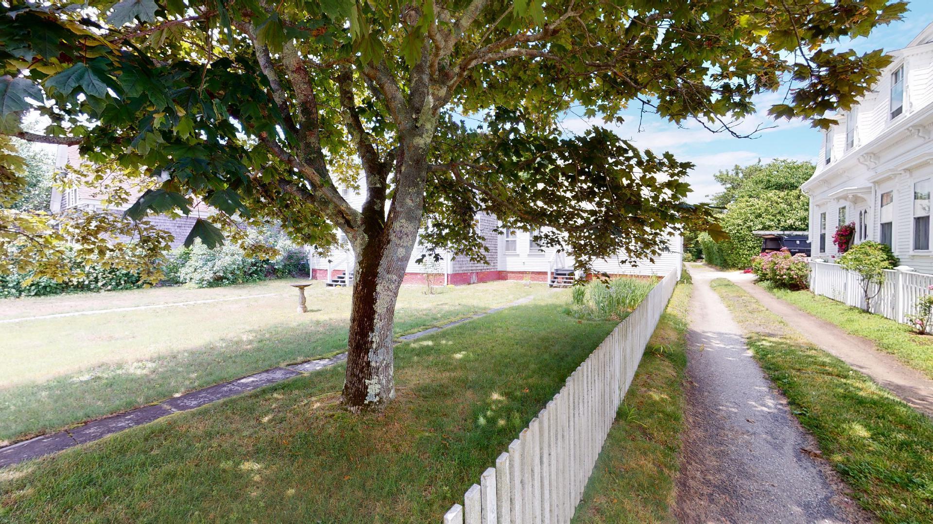 580 Commercial Street Provincetown, MA 02657 - Photo 4 of 58 a view of a street with a large tree