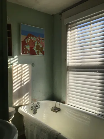 a view of house with garden space and trees