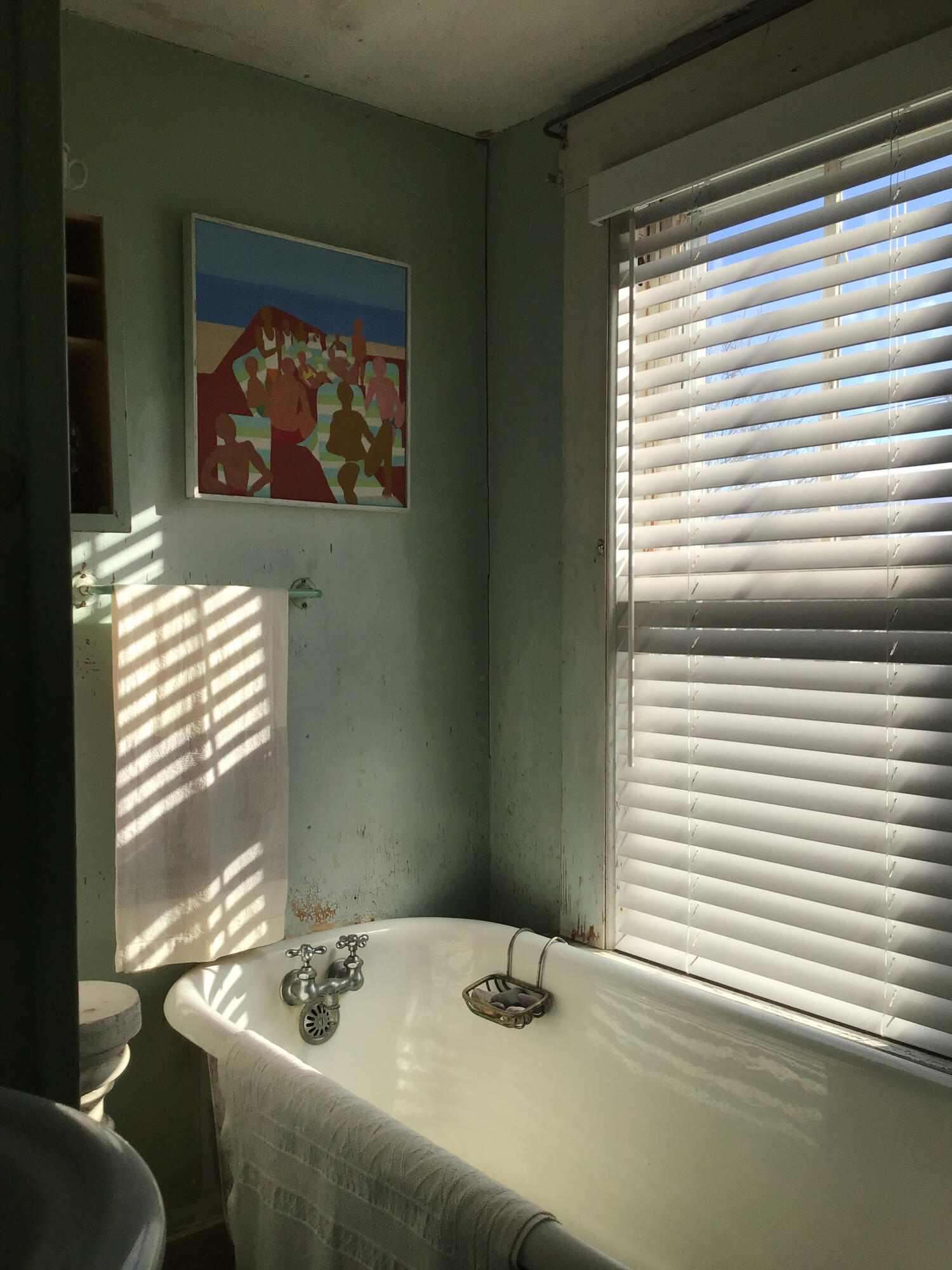 580 Commercial Street Provincetown, MA 02657 - Photo 49 of 58 a bedroom with a bed and a window