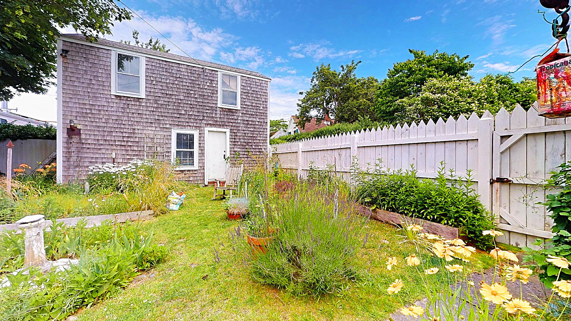 580 Commercial Street Provincetown, MA 02657 - Photo 53 of 58 a view of backyard with garden and plants