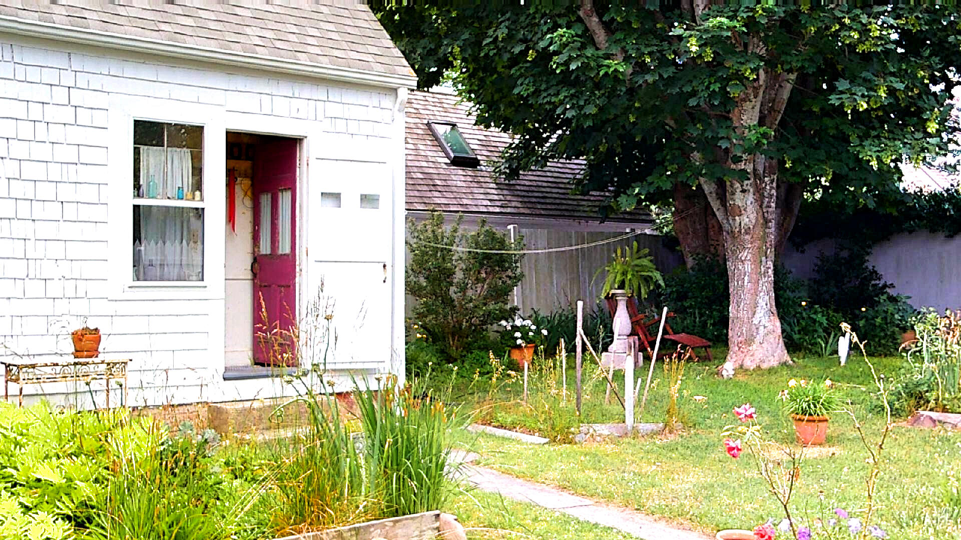 580 Commercial Street Provincetown, MA 02657 - Photo 54 of 58 front view of house with a yard