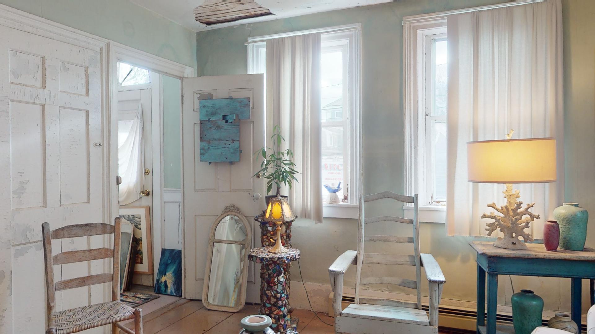 580 Commercial Street Provincetown, MA 02657 - Photo 10 of 58 a living room with furniture and a window