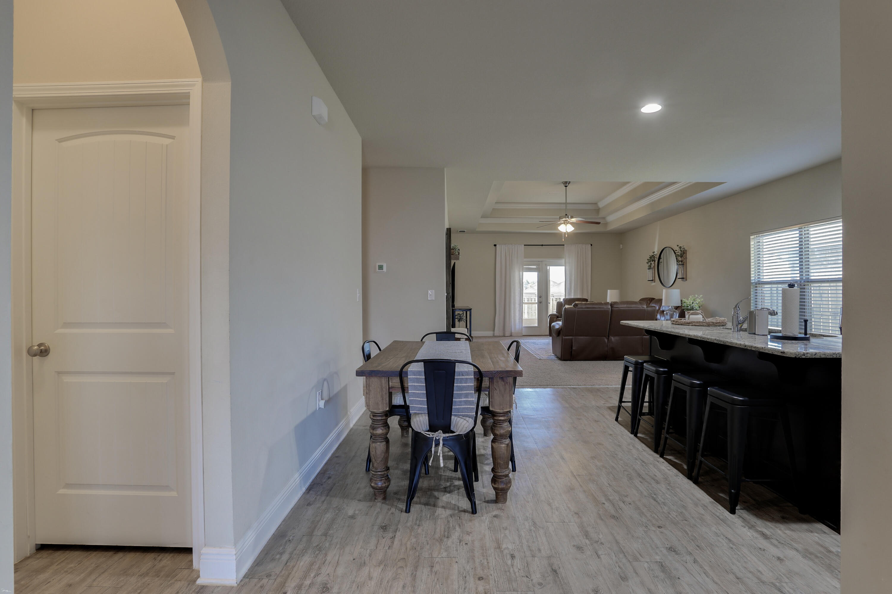 671 Teal Street Crestview, FL 32539 - Photo 12 of 41 a view of a dining room with furniture and wooden floor
