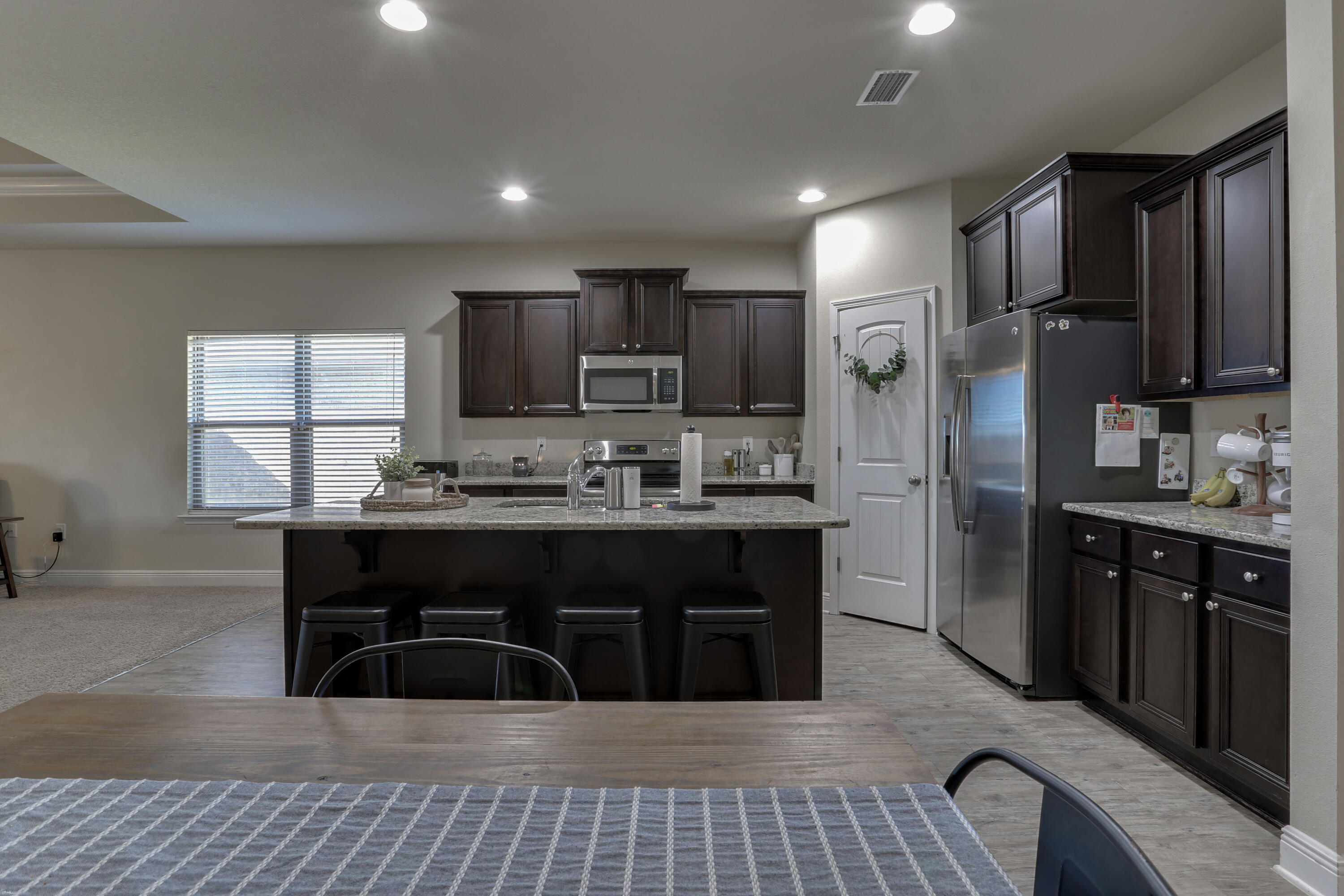 671 Teal Street Crestview, FL 32539 - Photo 14 of 41 a kitchen with a refrigerator and a sink