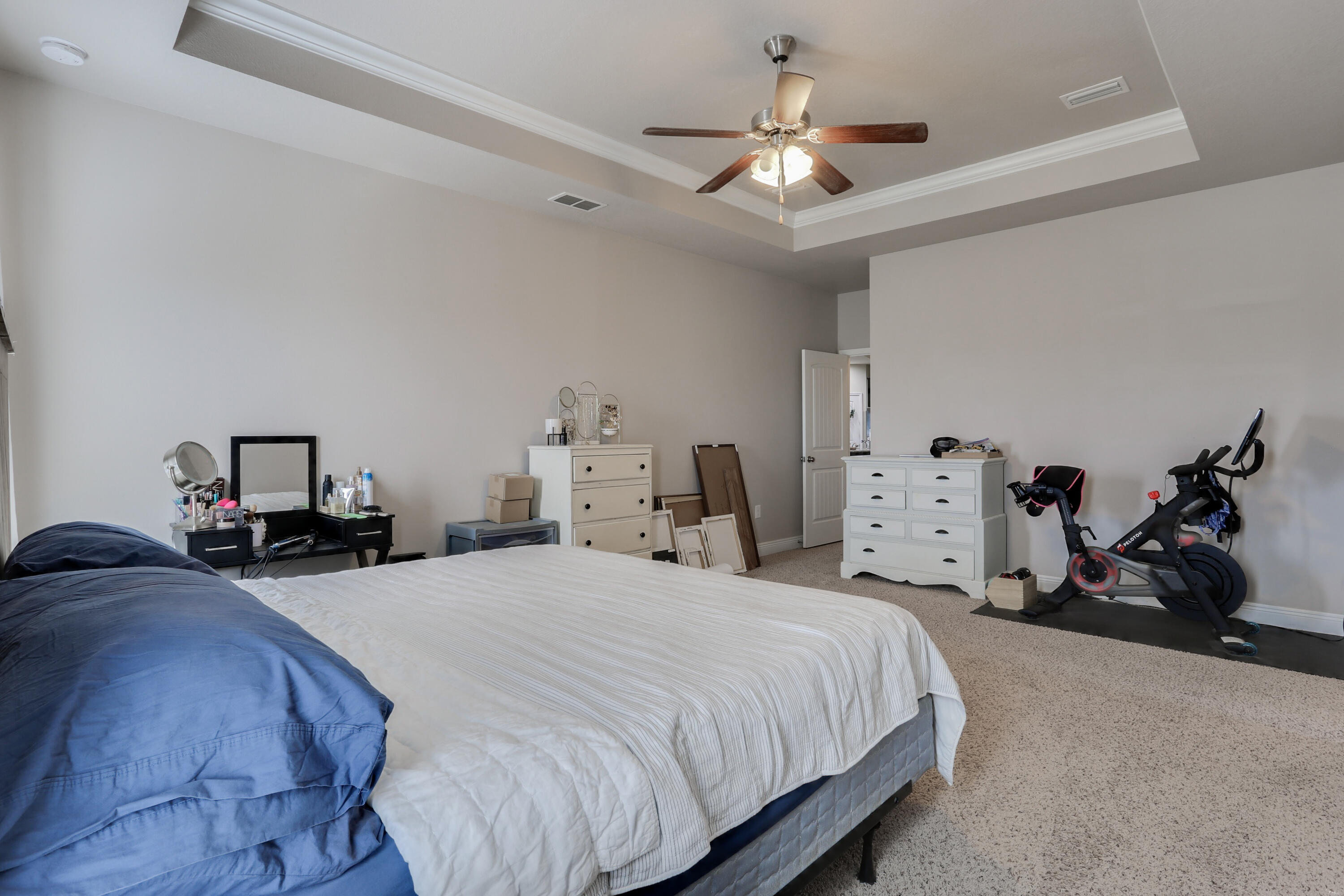 671 Teal Street Crestview, FL 32539 - Photo 29 of 41 a bedroom with bed and a chandelier