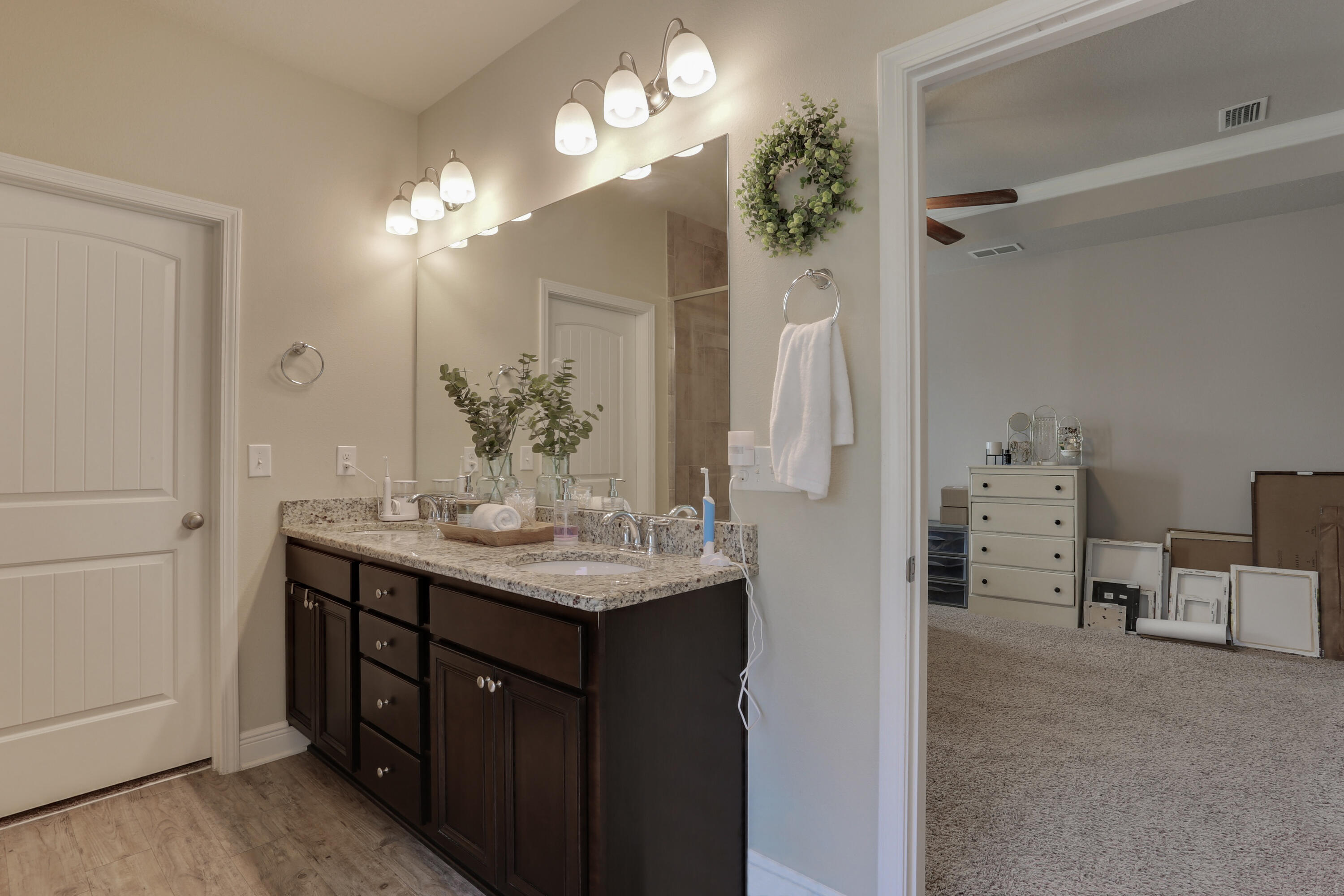 671 Teal Street Crestview, FL 32539 - Photo 31 of 41 a bathroom with a sink vanity granite and a mirror