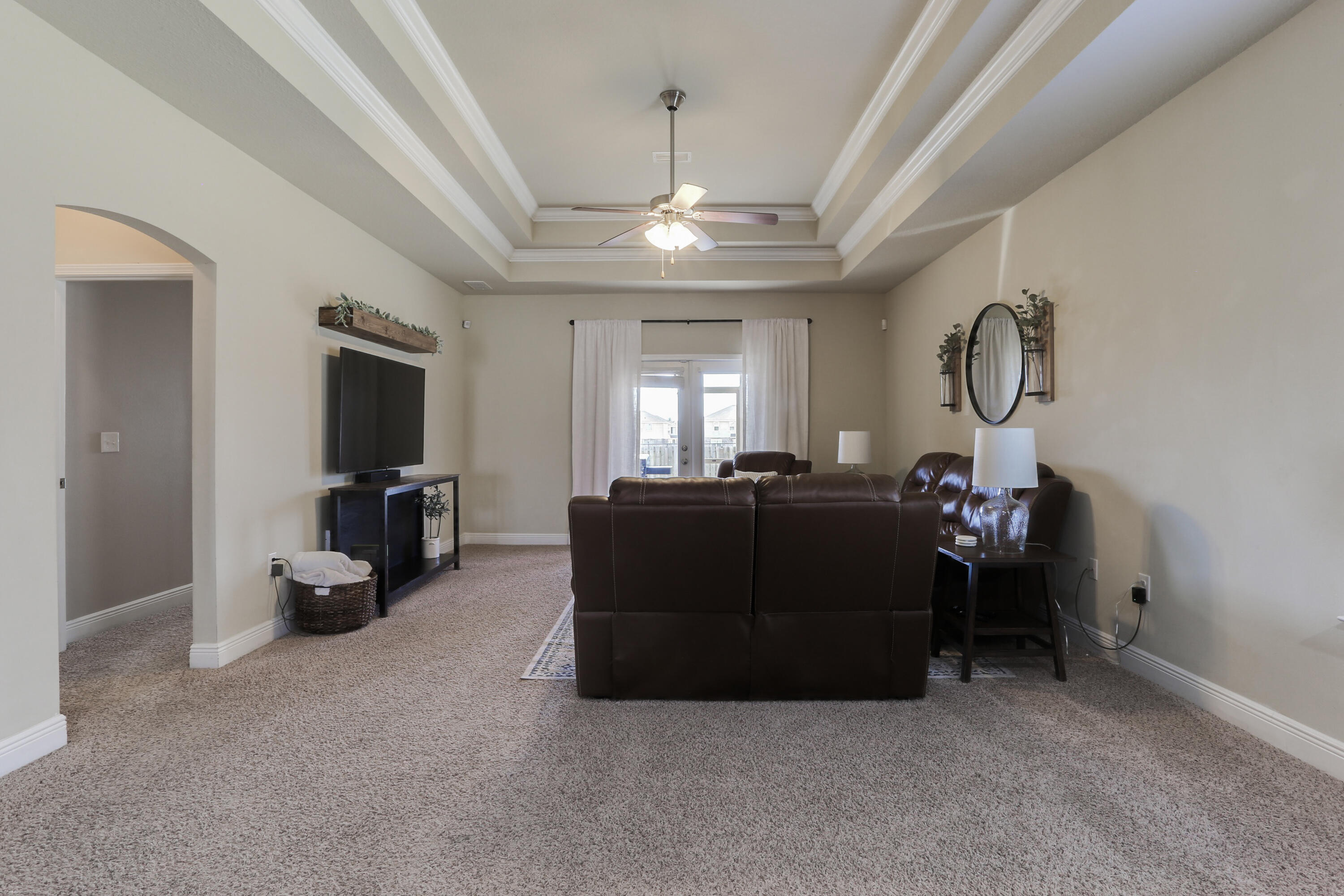671 Teal Street Crestview, FL 32539 - Photo 34 of 41 a living room with furniture and a chandelier