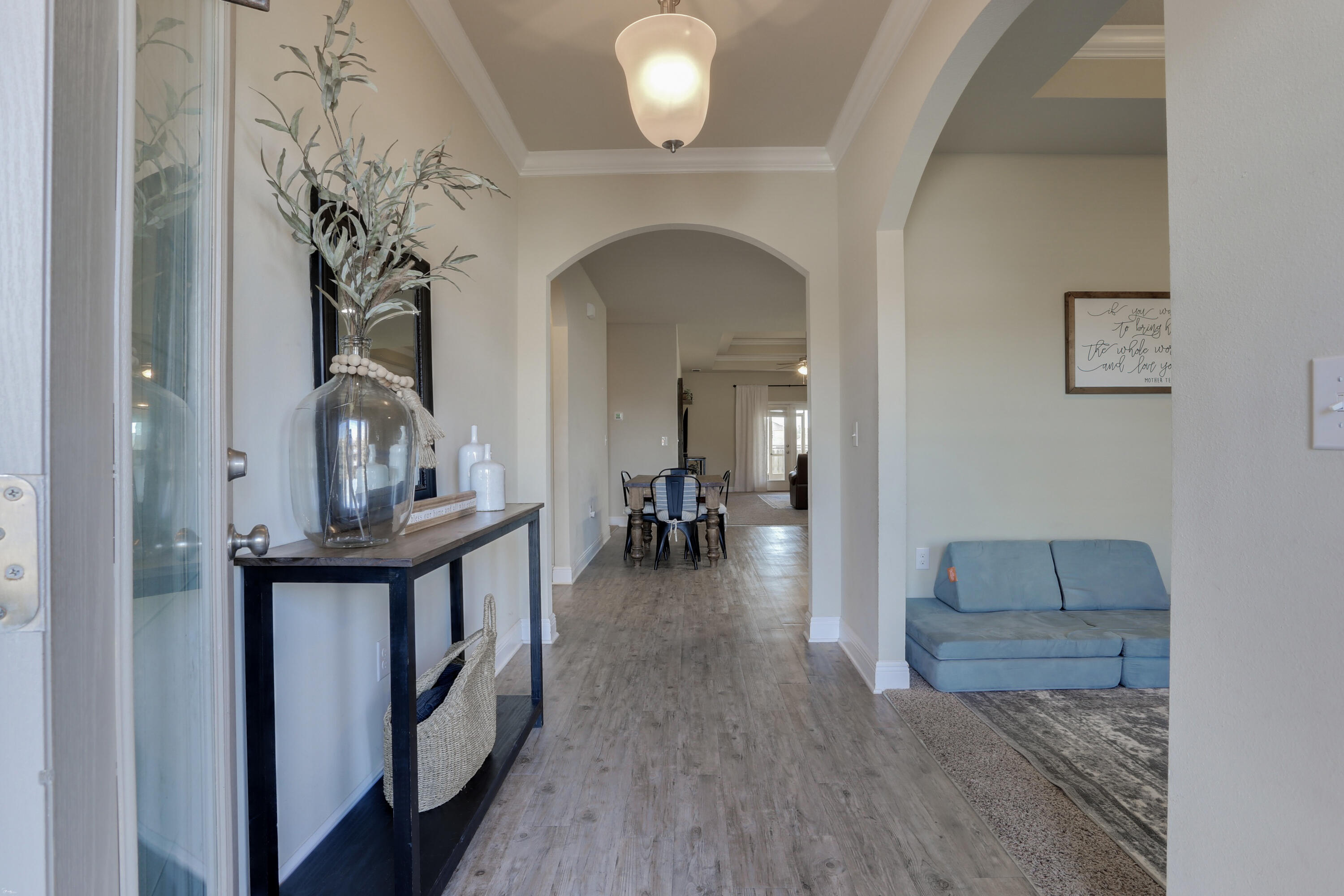 671 Teal Street Crestview, FL 32539 - Photo 6 of 41 a view of living room and bedroom with wooden floor