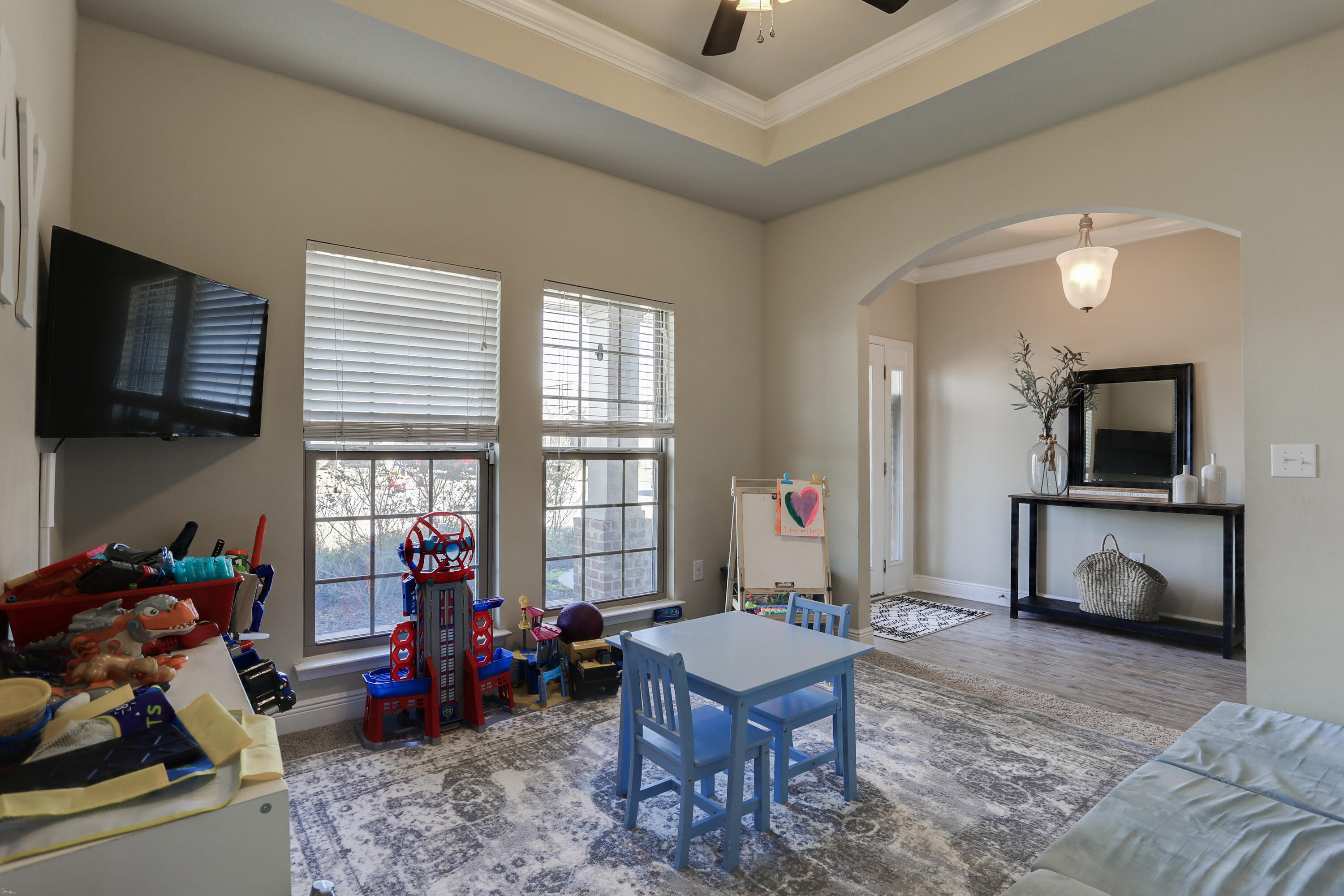 671 Teal Street Crestview, FL 32539 - Photo 10 of 41 a living room with furniture and a flat screen tv
