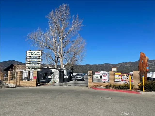 a view of street with parked cars