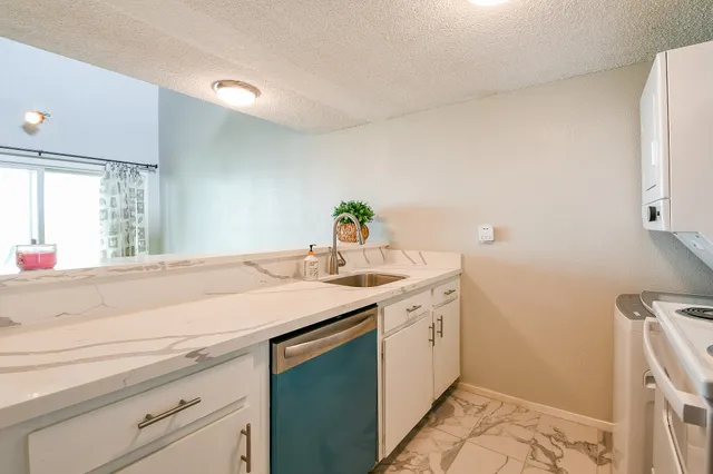 a kitchen with a sink and a window