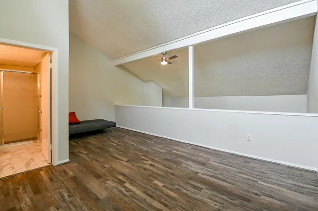 a view of a room with wooden floor and chair