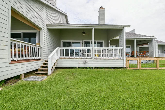 a view of a terrace with wooden floor and seating space
