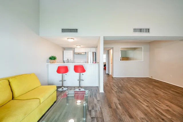 a view of an entryway with wooden floor