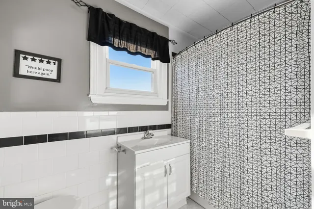 a bathroom with a sink and a shower
