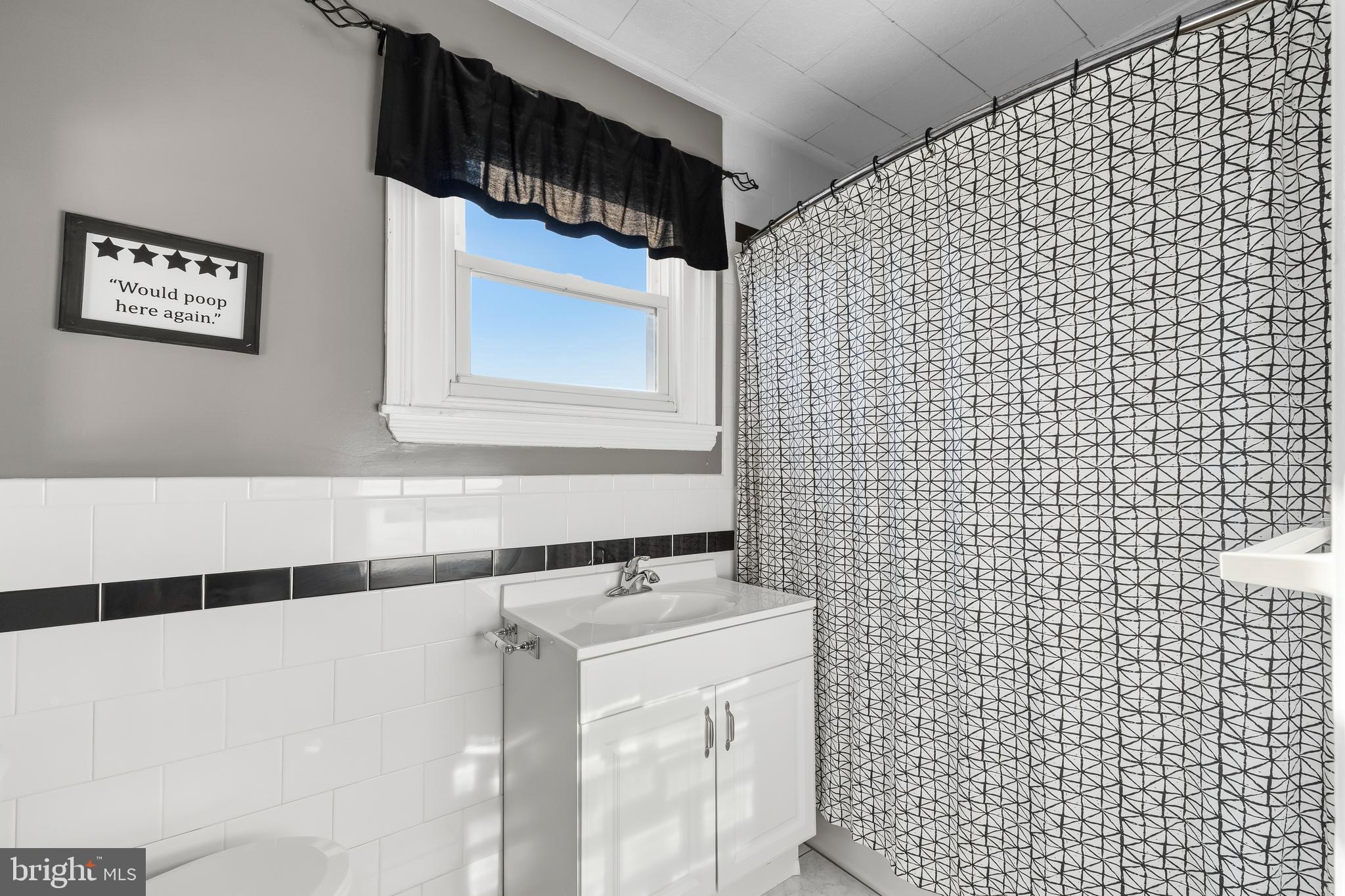 3061 Livingston Street Philadelphia, PA 19134 - Photo 14 of 28 a bathroom with a sink and a shower