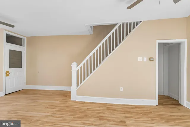 a view of an entryway with wooden floor