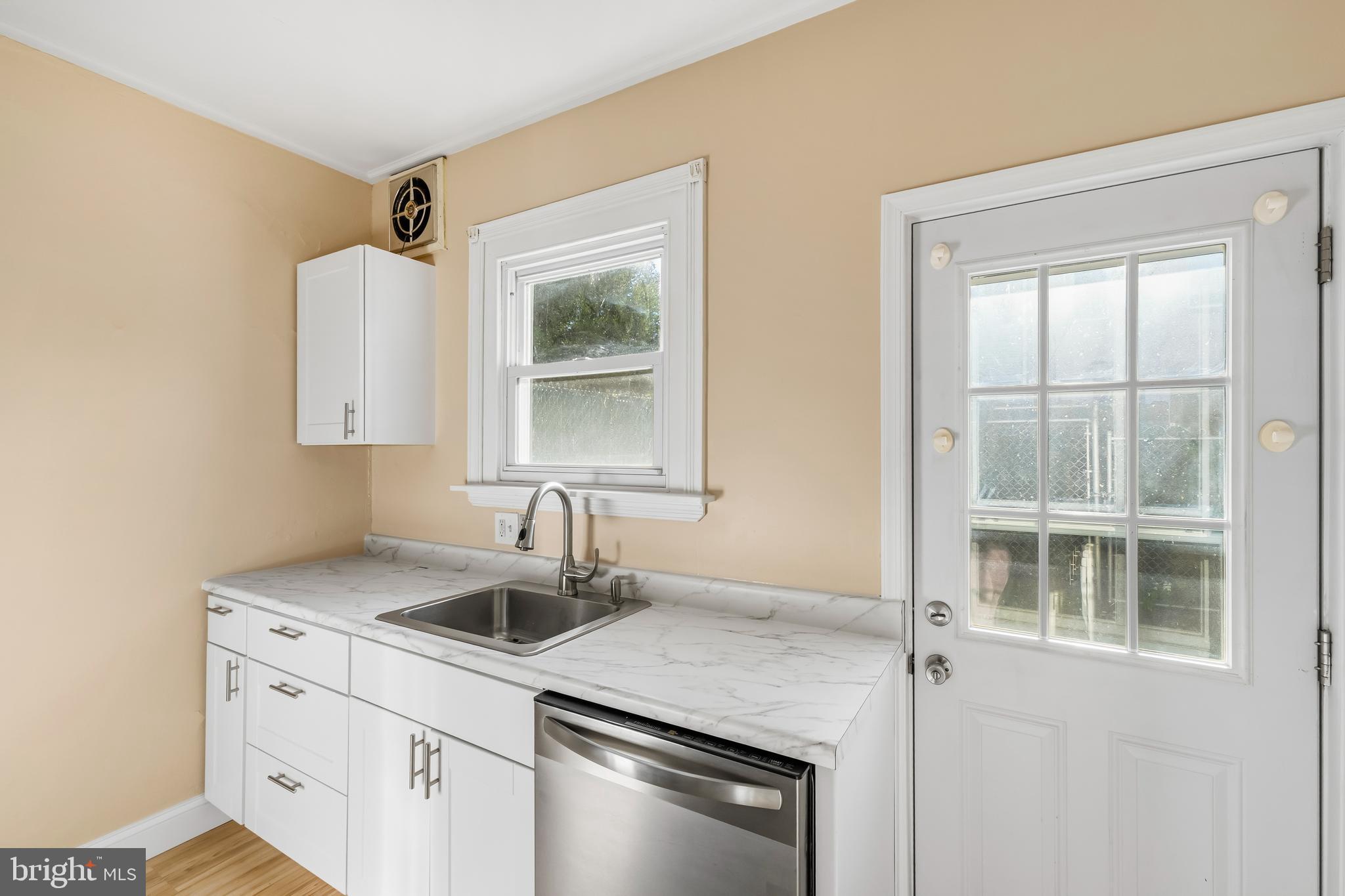 3061 Livingston Street Philadelphia, PA 19134 - Photo 8 of 28 a kitchen with a sink stove and window