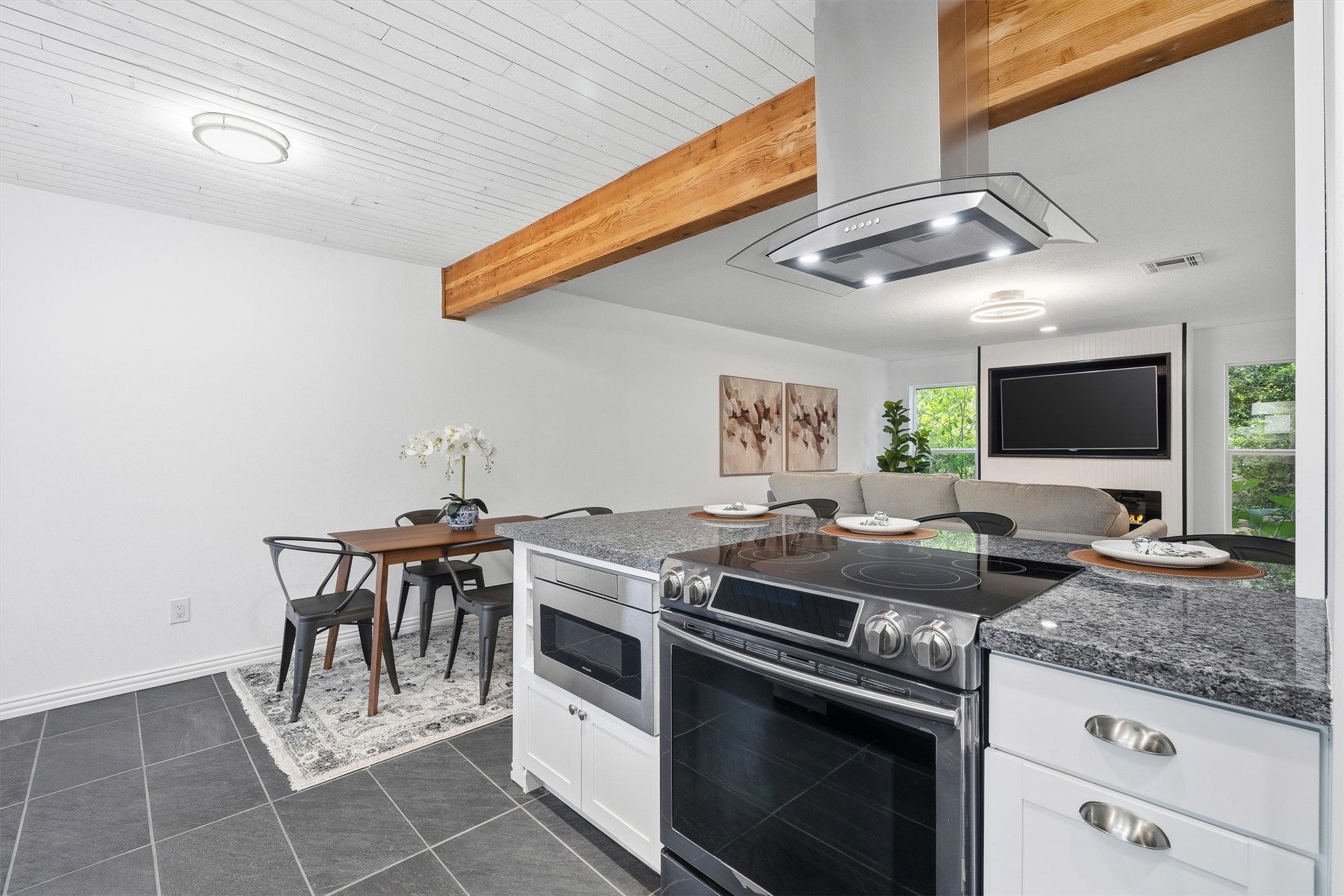 1011 Hamblen Road, Unit 306 Houston, TX 77339 - Photo 14 of 38 This angle highlights the island seating and range hood, giving a sense of how much room there is to cook, gather, and everything in between.