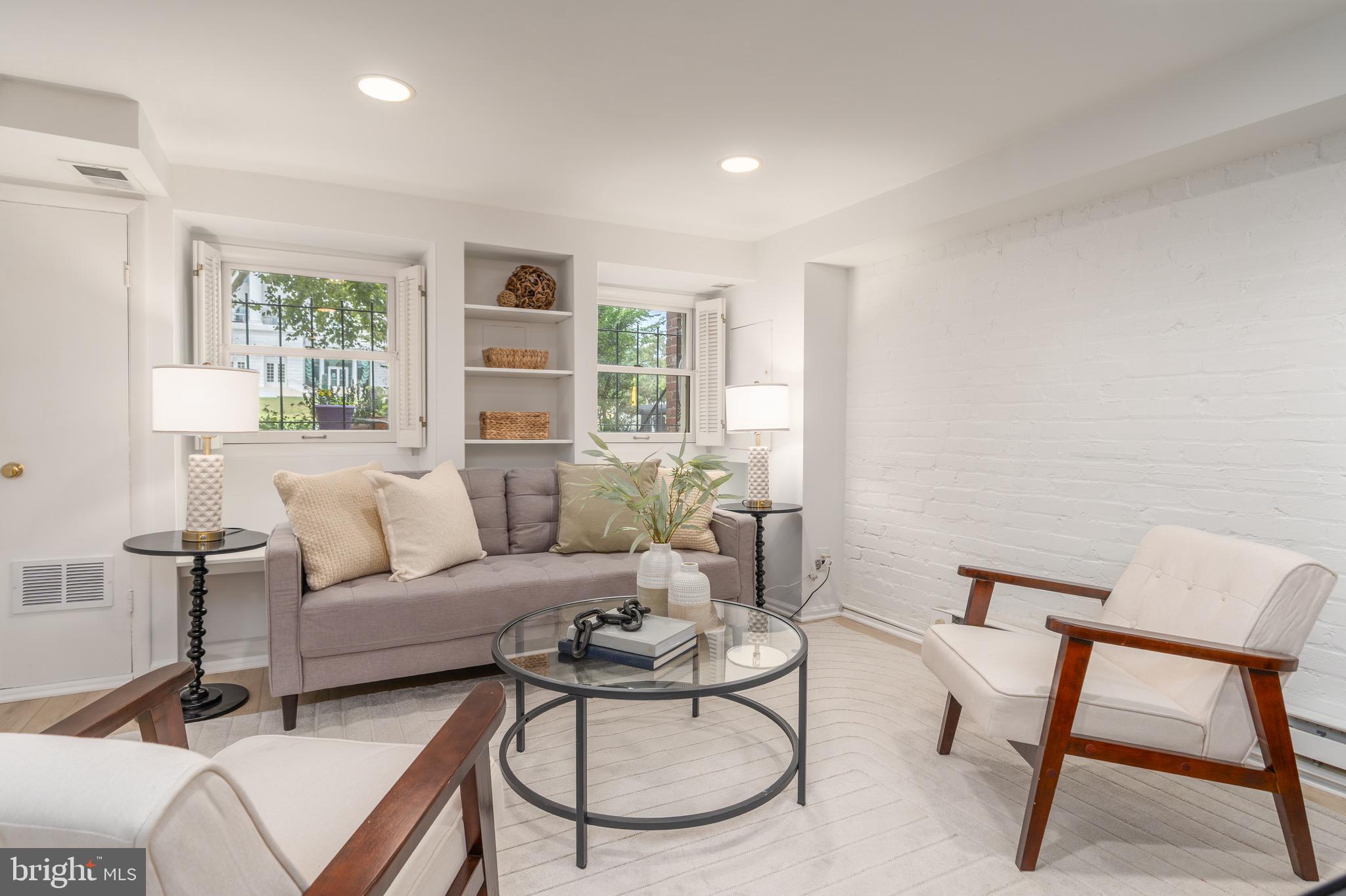 1683 35th Street Northwest, Unit B Washington, DC 20007 - Photo 3 of 10 a living room with furniture a table and a window