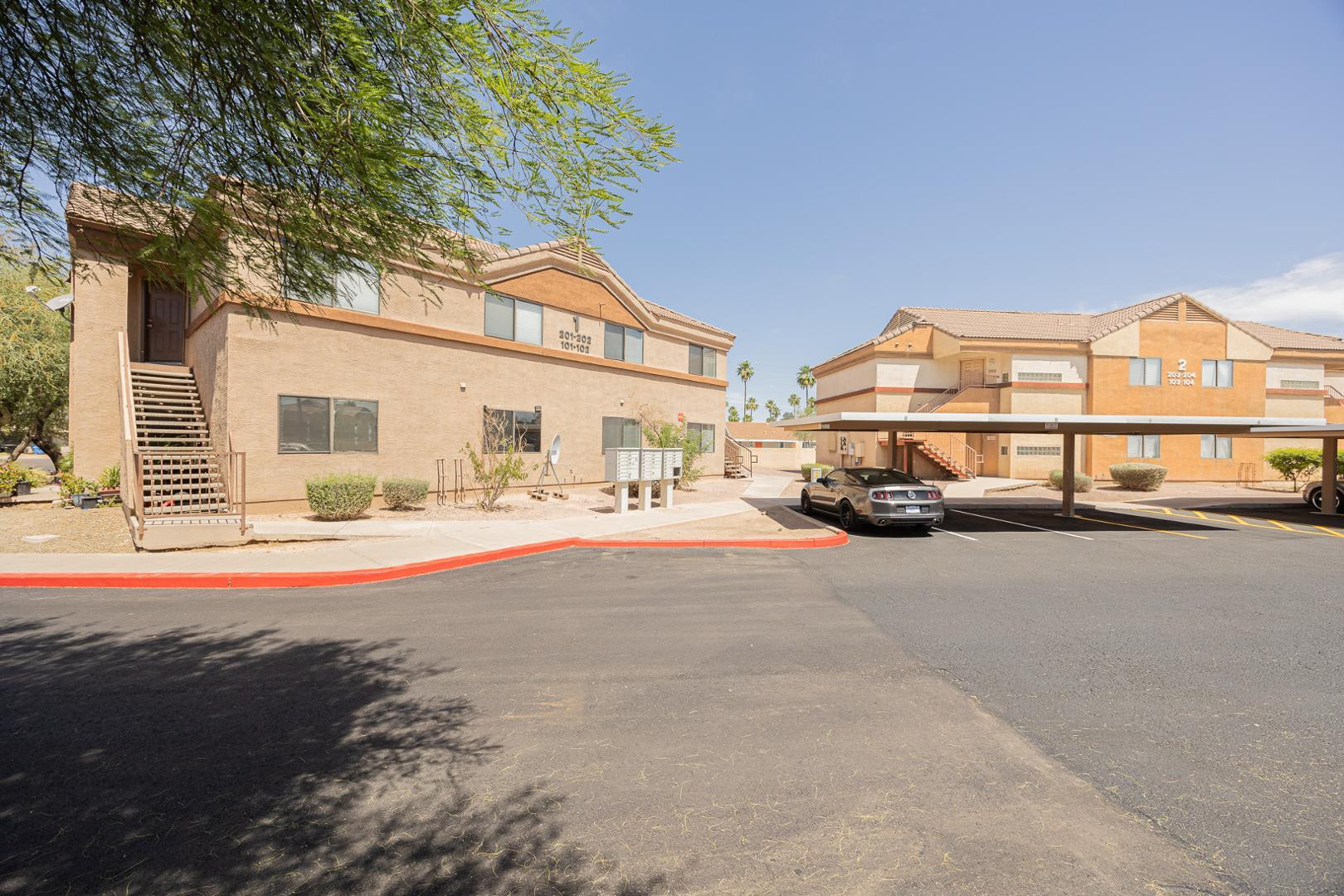 16033 North 25th Street, Unit 202 Phoenix, AZ 85032 - Photo 1 of 18 a car parked in front of a house