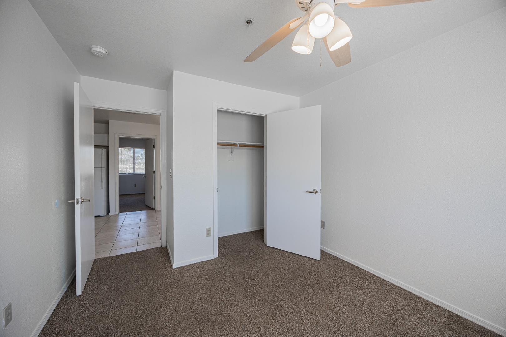 16033 North 25th Street, Unit 202 Phoenix, AZ 85032 - Photo 13 of 18 a view of a chandelier fan and entryway