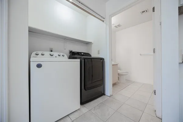 a utility room with dryer and washer