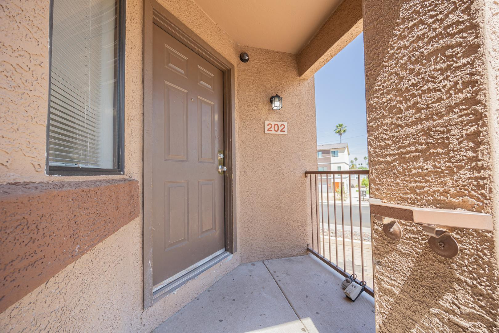 16033 North 25th Street, Unit 202 Phoenix, AZ 85032 - Photo 3 of 18 a view of a door and a window