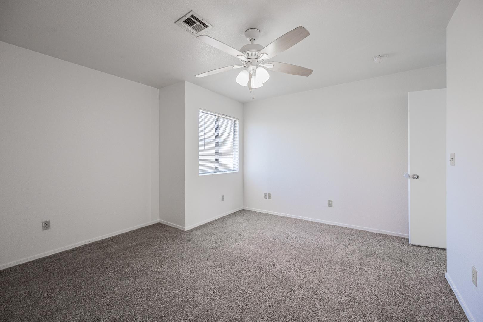 16033 North 25th Street, Unit 202 Phoenix, AZ 85032 - Photo 10 of 18 a view of an empty room with a window