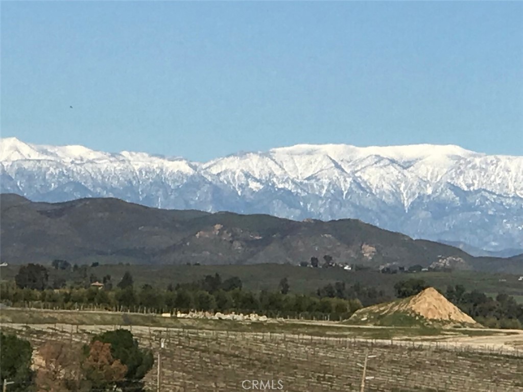 a view of mountain with sunset