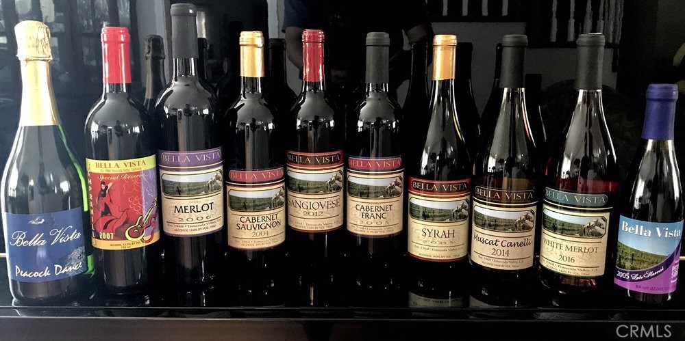 41220 Calle Contento Temecula, CA 92592 - Photo 22 of 30 a bunch of bottles sitting on a shelf