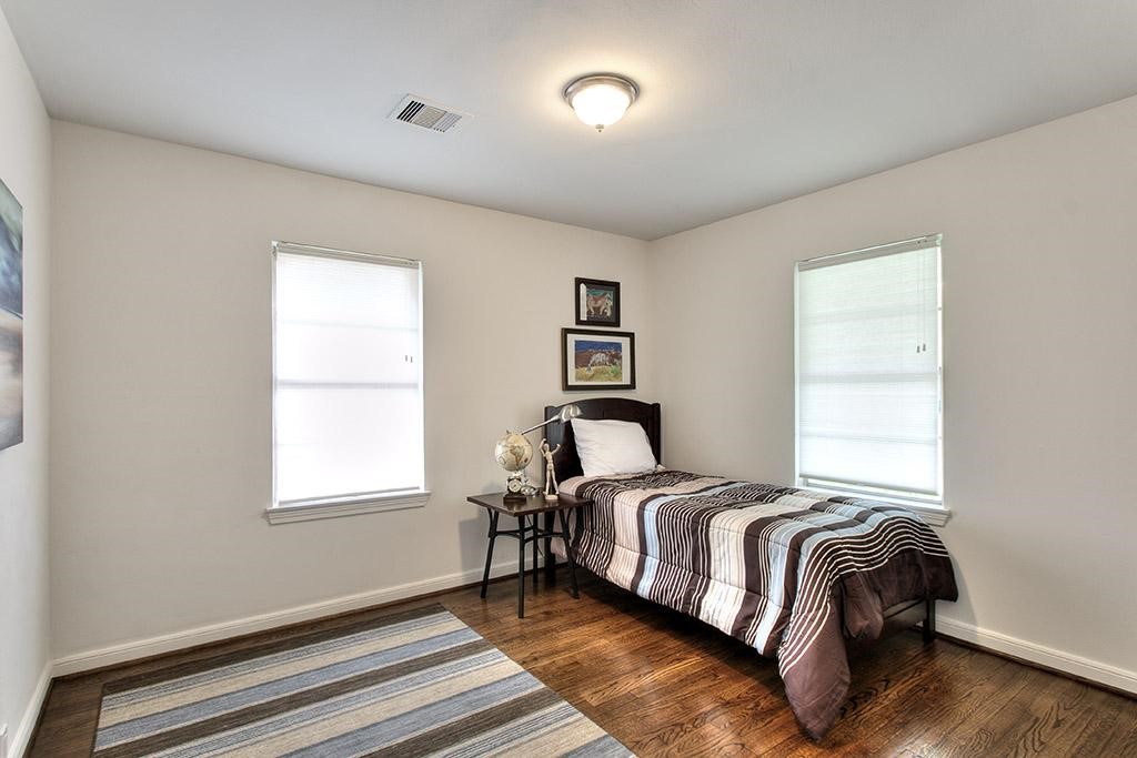 3110 Deal Street Houston, TX 77025 - Photo 8 of 10 a bedroom with a bed and a window