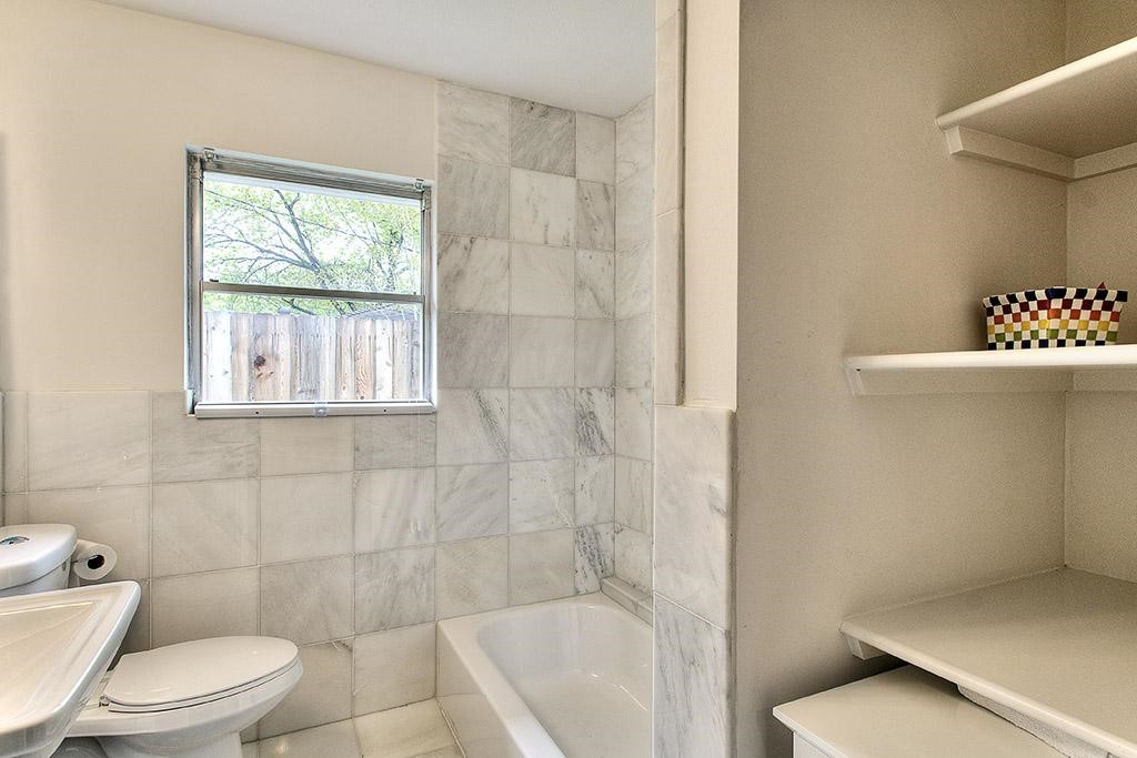 3110 Deal Street Houston, TX 77025 - Photo 9 of 10 a bathroom with a toilet and a shower