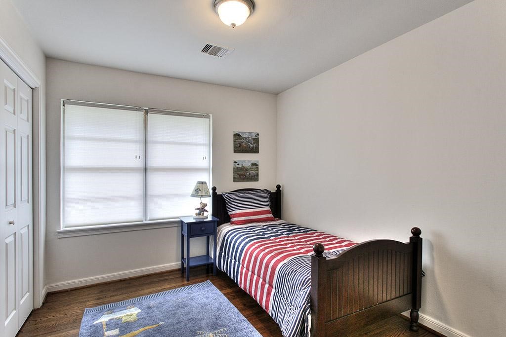 3110 Deal Street Houston, TX 77025 - Photo 10 of 10 a bedroom with a bed and window