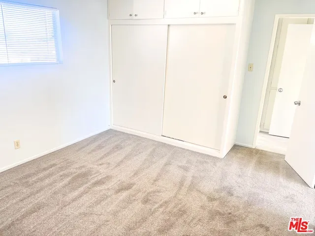 an empty room with a bench