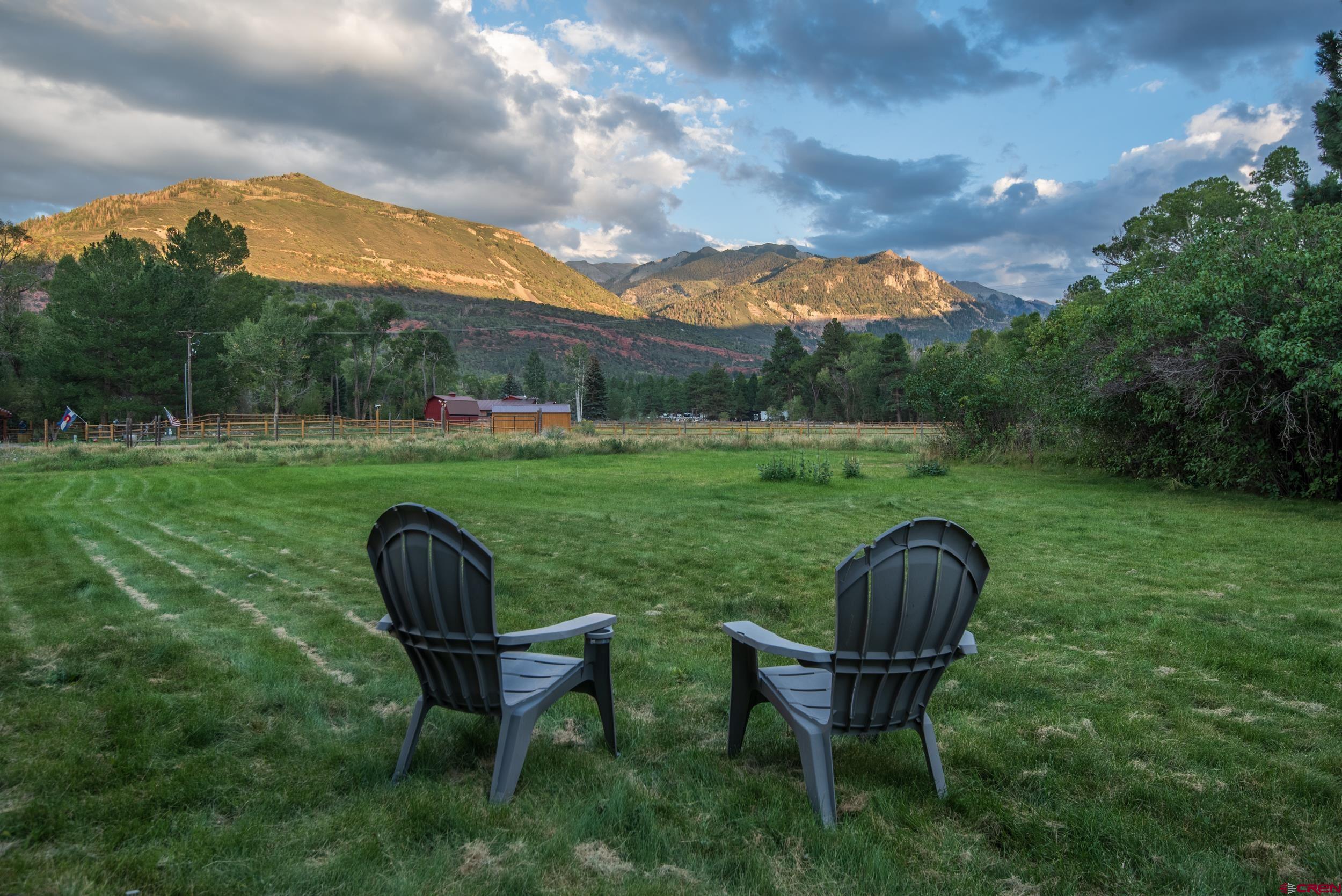 559 Suzanne Lane Ridgway, CO 81432 - Photo 2 of 45 a view of a table and chairs in the garden