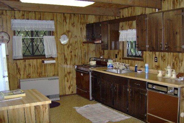 630 Decker Road Bushkill, PA 18324 - Photo 3 of 7 a kitchen with a sink and a refrigerator