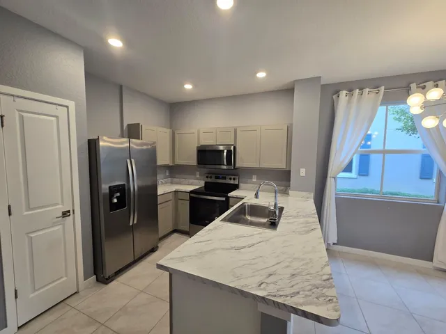 a view of kitchen and windows
