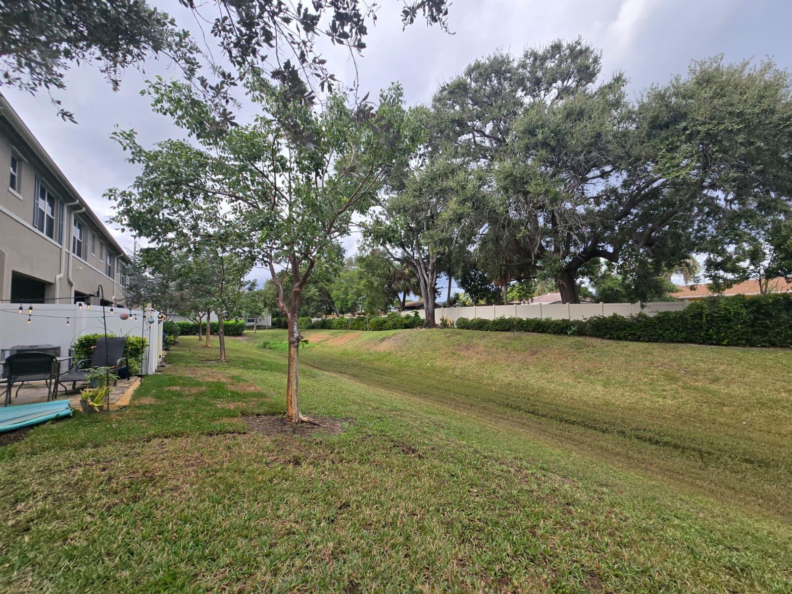 140 Bandol Street Riviera Beach, FL 33404 - Photo 18 of 42 a view of a park with large trees
