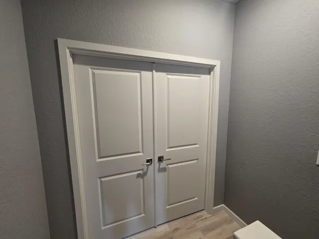 a view of a hallway with a white walls